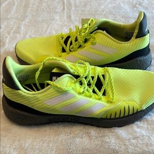 Bright Yellow Athletic Shoes with White Stripes